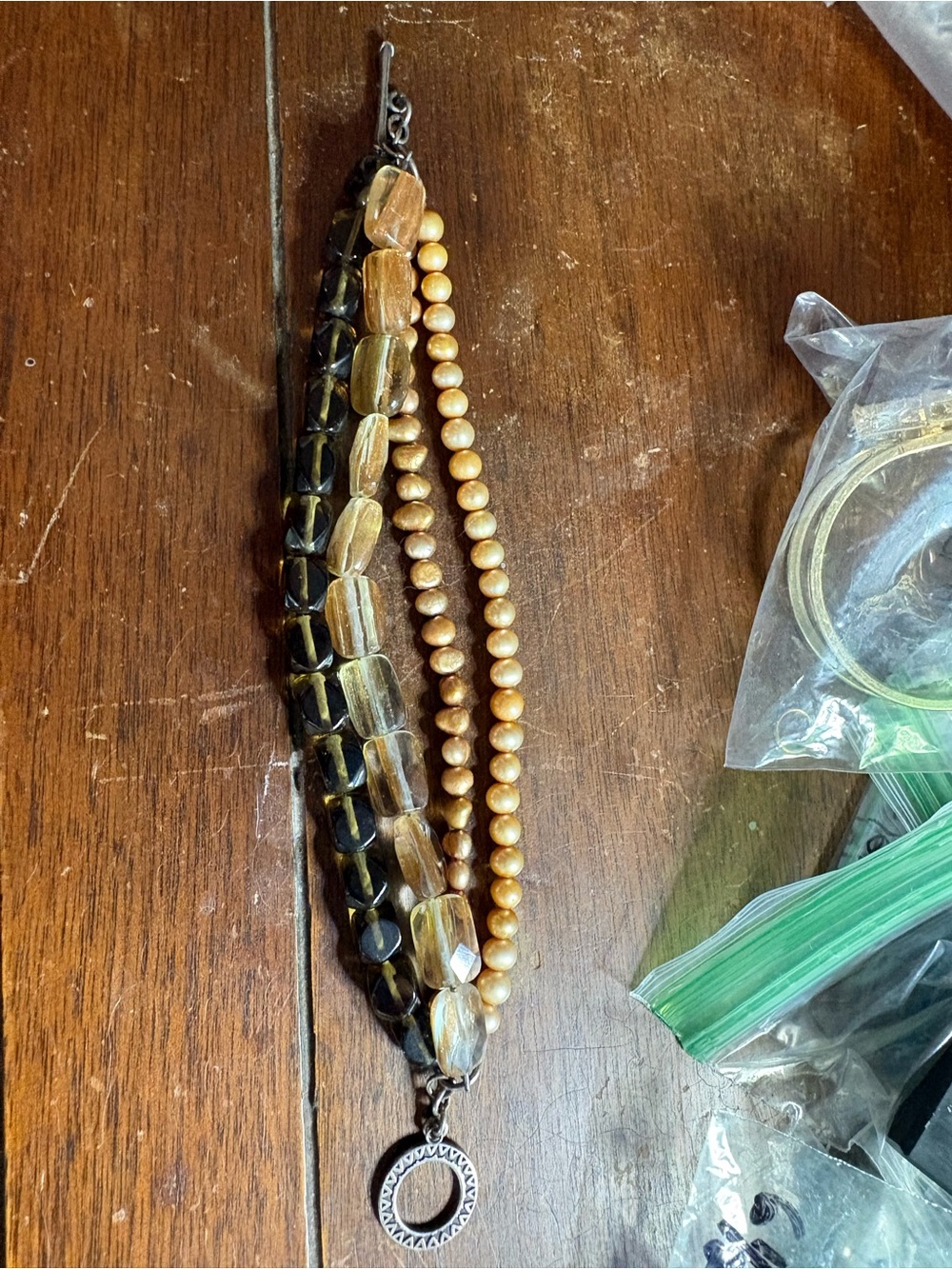 Women's Gold and Brown Beaded Multi-Strand Necklace. Size 6 1/2- 6 3/4